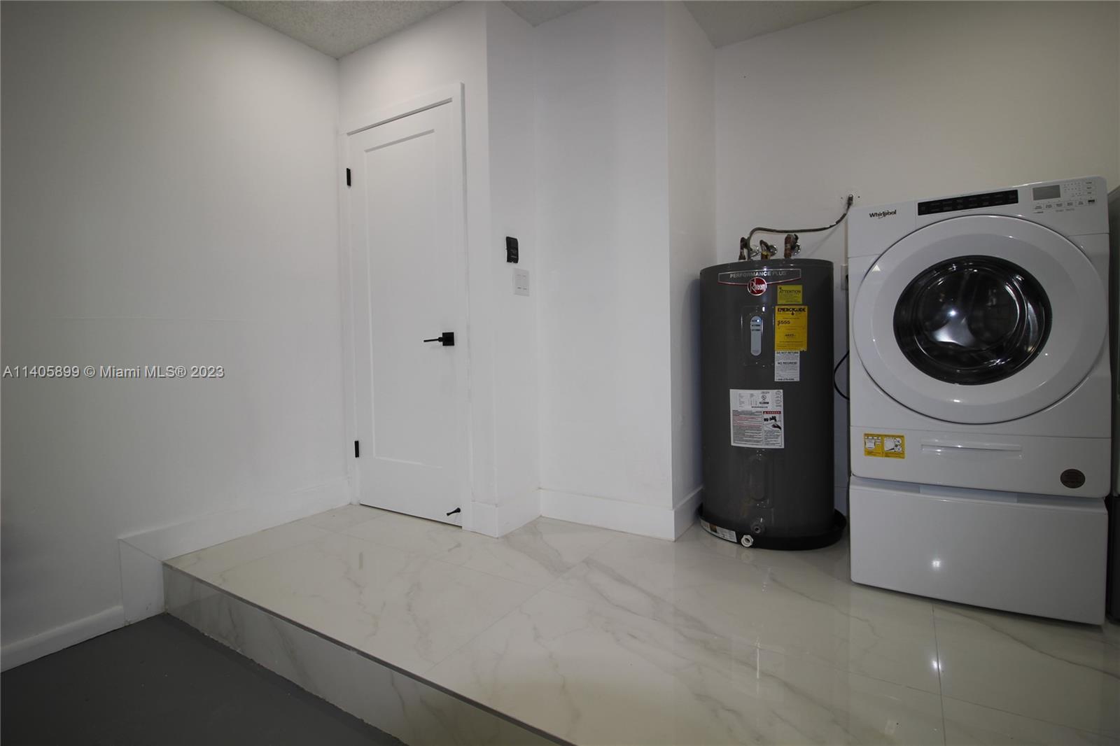 10810 Southwest 28th Street Miami, FL 33165 - Photo 41 of 45 a utility room with dryer and washer