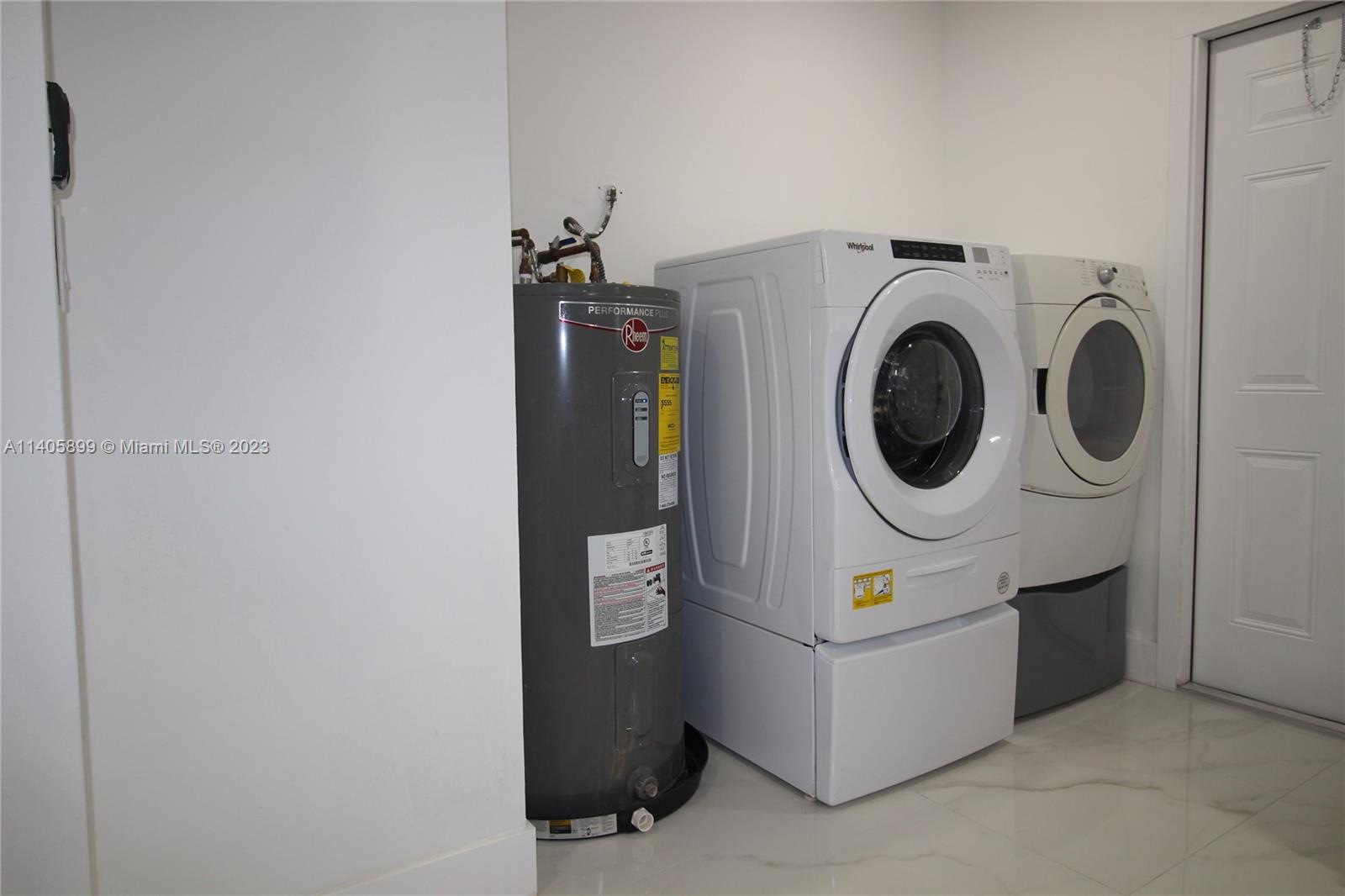 10810 Southwest 28th Street Miami, FL 33165 - Photo 42 of 45 a utility room with dryer and washer