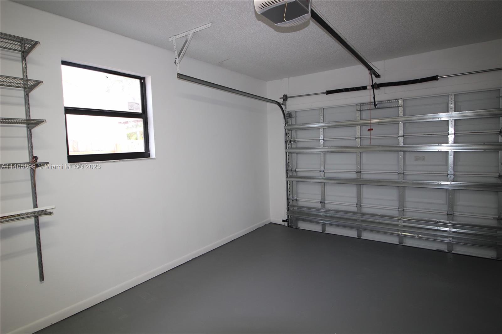 10810 Southwest 28th Street Miami, FL 33165 - Photo 43 of 45 a view of a room with rack on the wall