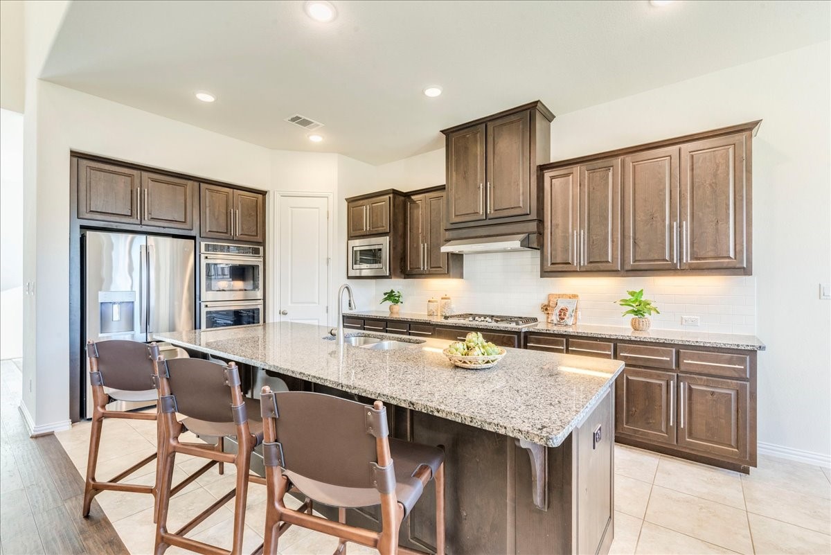 1689 Cool Spring Way Austin, TX 78737 - Photo 5 of 40 tons of cabinets, counterspace and stainless steel appliances.