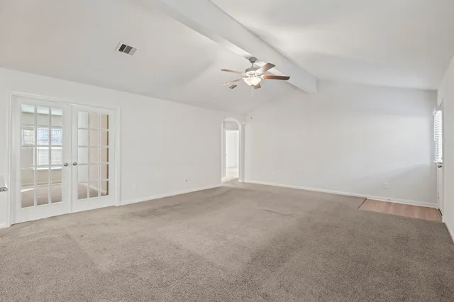 a view of a backyard with brick wall