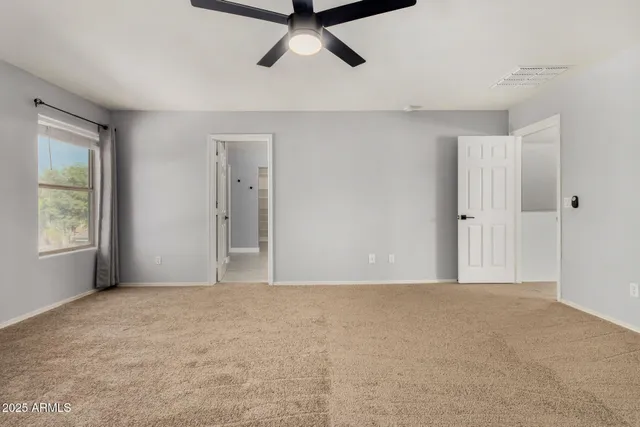 a view of an empty room with a window