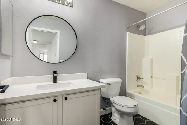 a bathroom with a sink toilet and a mirror