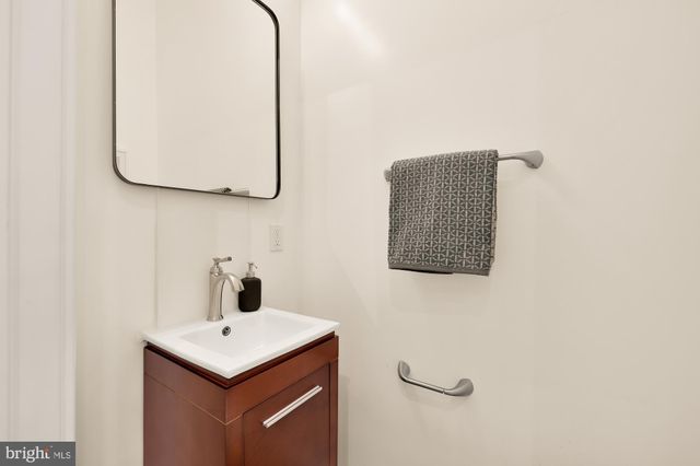a bathroom with a sink and mirror