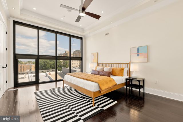 a bathroom with a tub shower and mirror