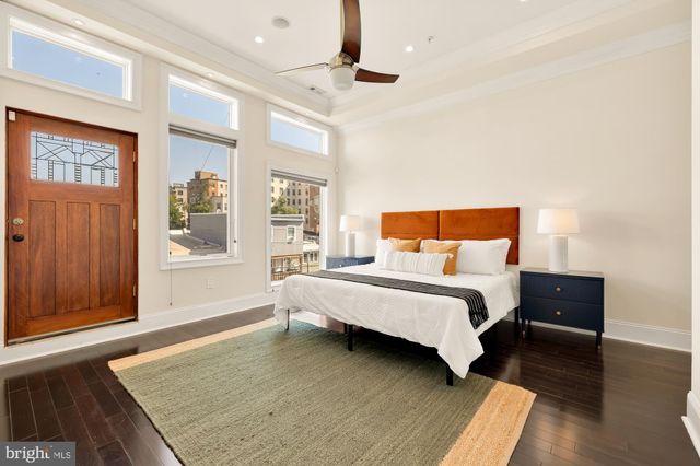 a bedroom with a bed and a couch