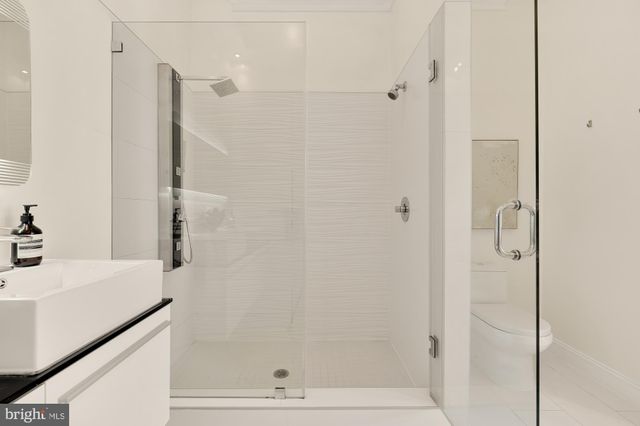 a living room with furniture a window and a chandelier
