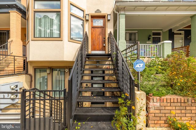a front view of a house with large windows
