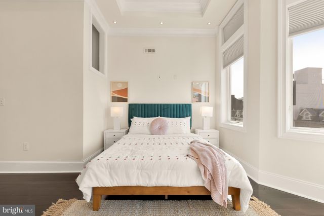 a bathroom with a sink a mirror a bathtub and a toilet