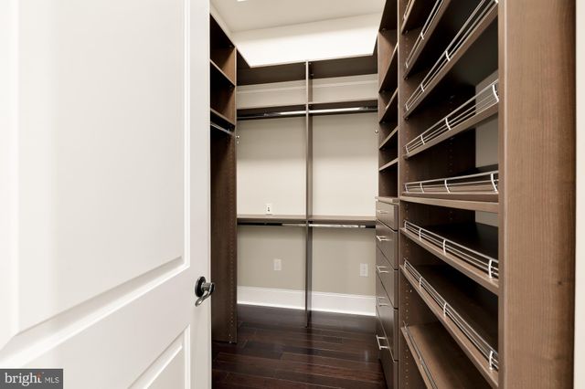 an outdoor sitting area with furniture and lake view