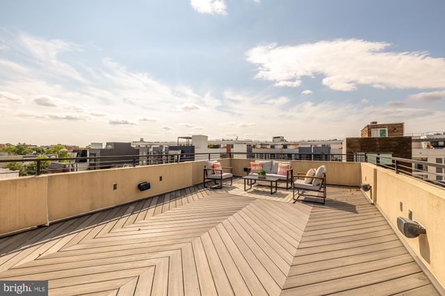 a view of a terrace with seating area