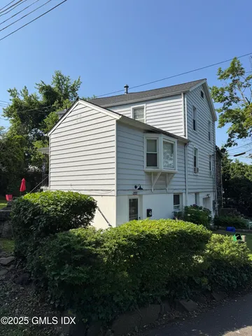 a view of a house with a garden