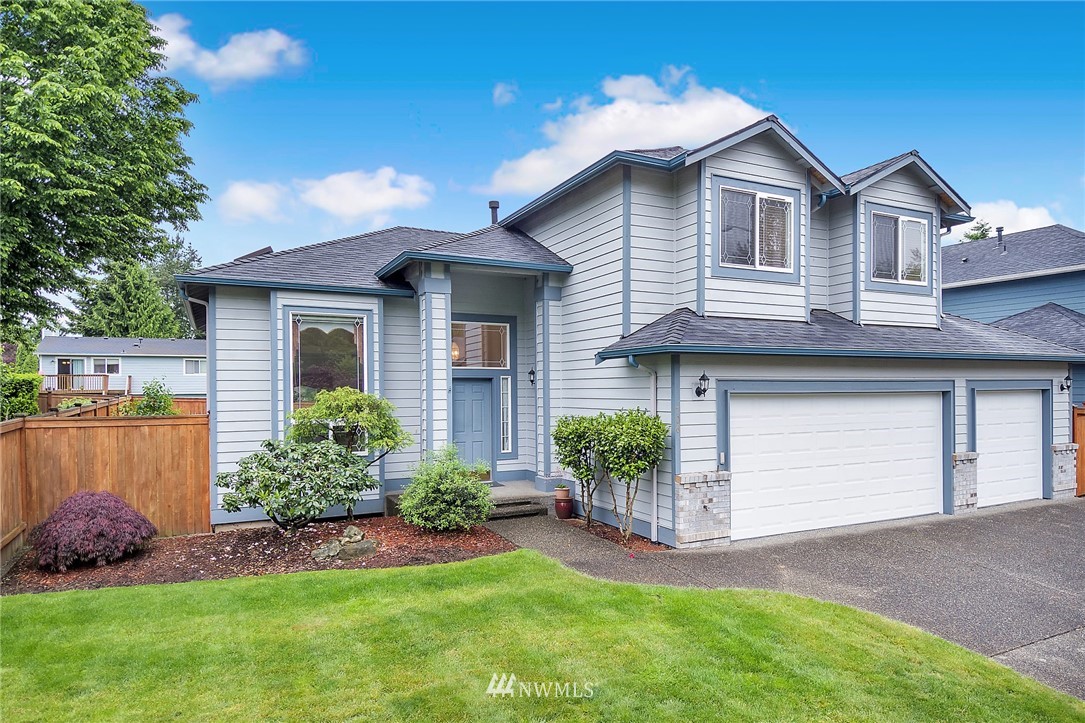 706 203rd Street Southeast Bothell, WA 98012 - Photo 1 of 21 a front view of a house with a garden and plants