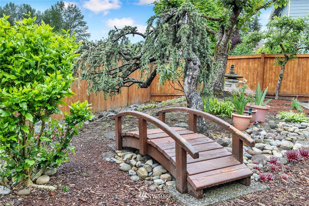 706 203rd Street Southeast Bothell, WA 98012 - Photo 2 of 21 a view of a bench in a backyard