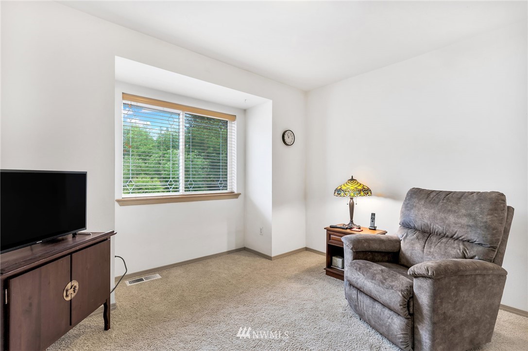 706 203rd Street Southeast Bothell, WA 98012 - Photo 15 of 21 a living room with furniture and a flat screen tv