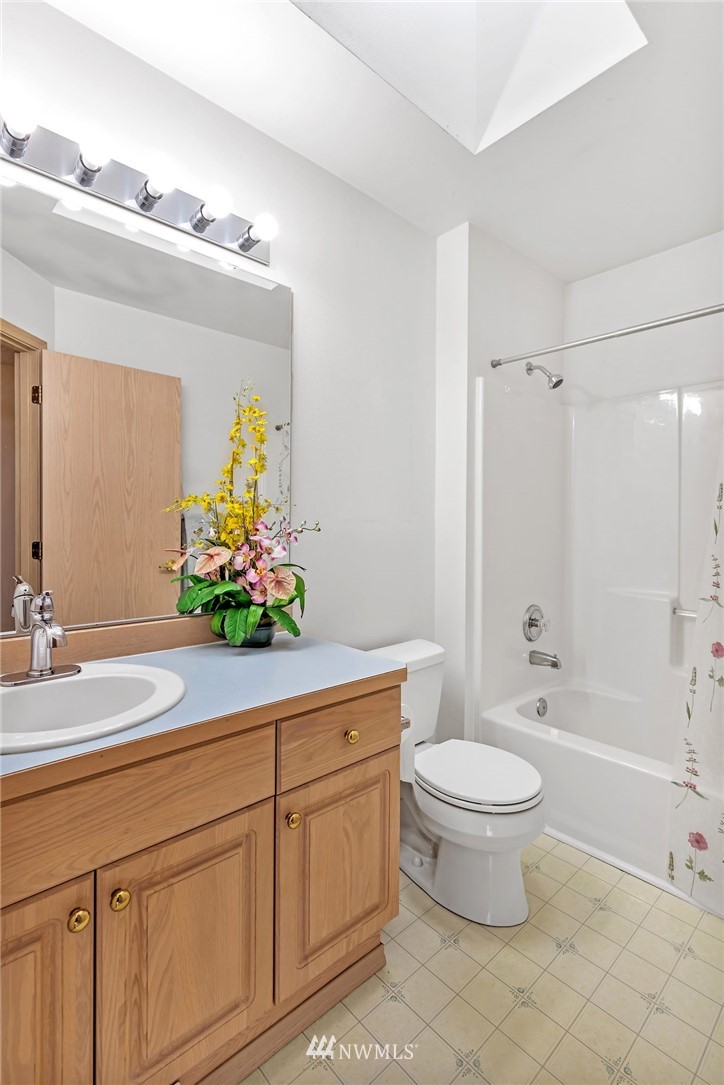 706 203rd Street Southeast Bothell, WA 98012 - Photo 17 of 21 a bathroom with a sink a toilet and bathtub