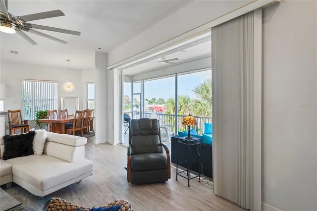 a large kitchen with stainless steel appliances kitchen island granite countertop a lot of counter space and wooden floors