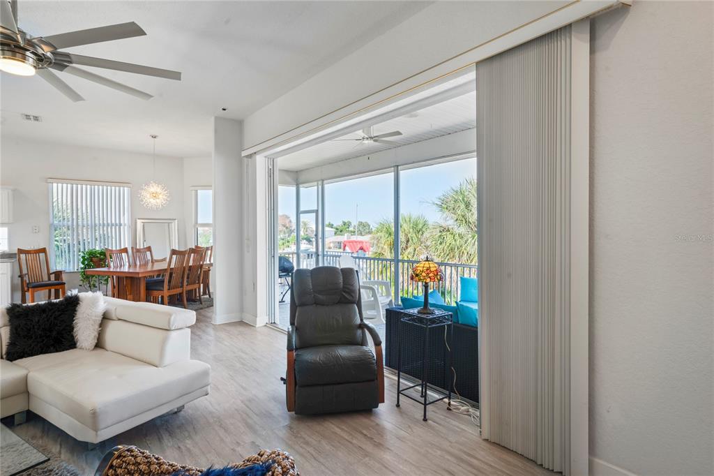 3459 Flamingo Boulevard Hernando Beach, FL 34607 - Photo 12 of 94 a living room with furniture and a large window