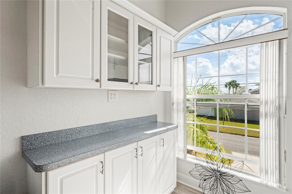 3459 Flamingo Boulevard Hernando Beach, FL 34607 - Photo 18 of 94 a kitchen with stainless steel appliances granite countertop a stove and a white cabinets