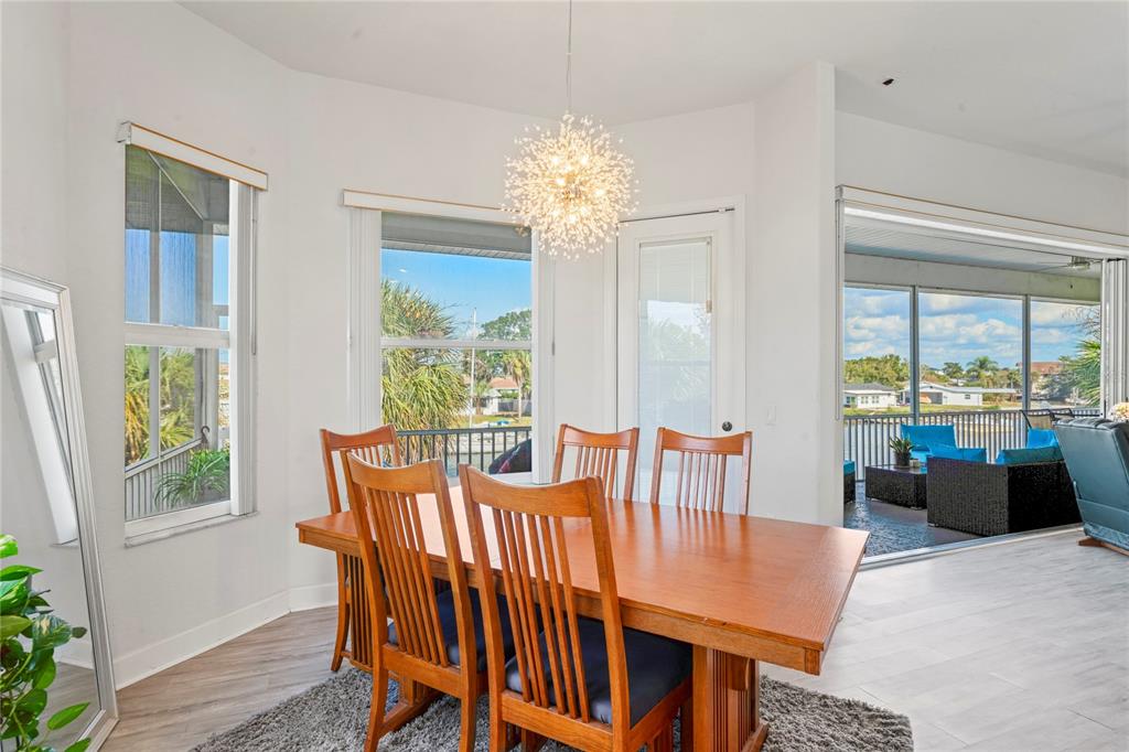 3459 Flamingo Boulevard Hernando Beach, FL 34607 - Photo 26 of 94 a view of a dining room with furniture window and outside view