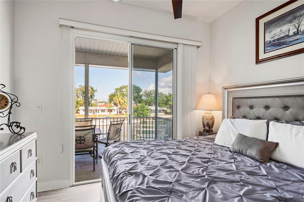 3459 Flamingo Boulevard Hernando Beach, FL 34607 - Photo 37 of 94 a bedroom with a large bed and a window