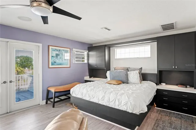 a view of a dining room with furniture and a potted plant
