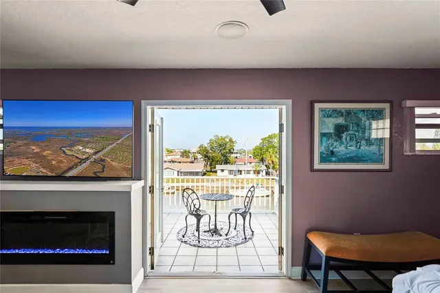 a view of swimming pool with outdoor seating and city view