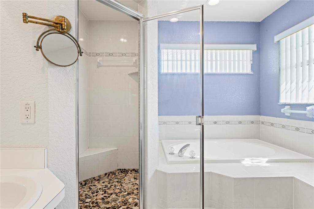 3459 Flamingo Boulevard Hernando Beach, FL 34607 - Photo 52 of 94 a bathroom with a sink a toilet and shower