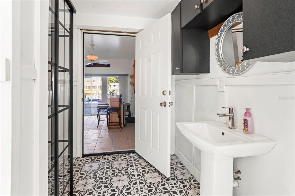 3459 Flamingo Boulevard Hernando Beach, FL 34607 - Photo 55 of 94 a bathroom with a sink and a mirror