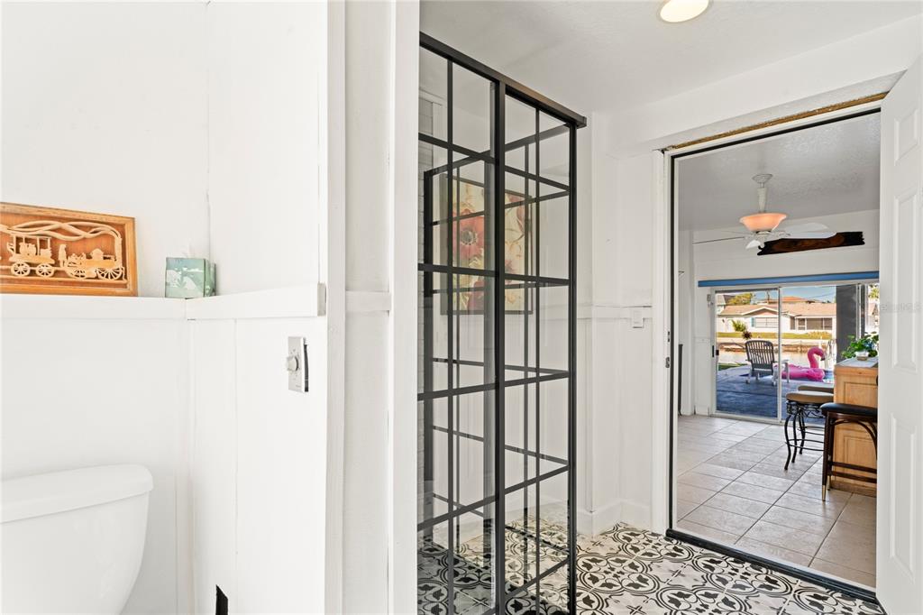 3459 Flamingo Boulevard Hernando Beach, FL 34607 - Photo 56 of 94 a view of a hallway with wooden floor and dining room
