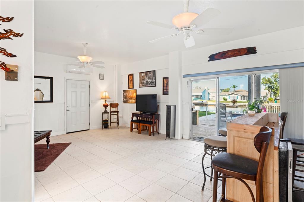 3459 Flamingo Boulevard Hernando Beach, FL 34607 - Photo 59 of 94 a view of a livingroom with furniture and a flat screen tv