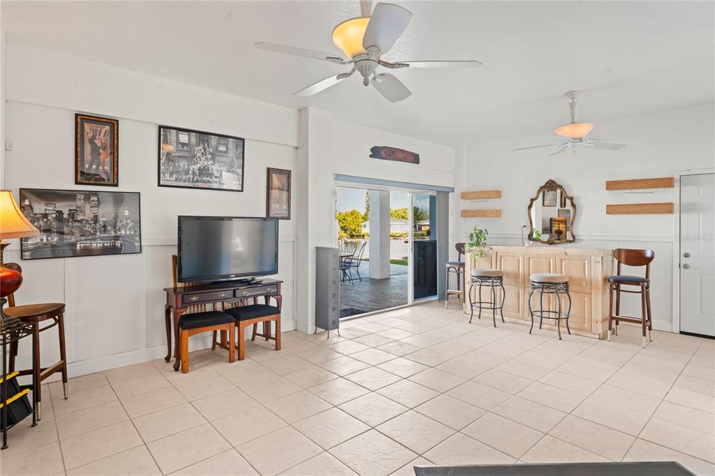 3459 Flamingo Boulevard Hernando Beach, FL 34607 - Photo 60 of 94 a living room with furniture and a flat screen tv