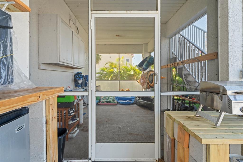 3459 Flamingo Boulevard Hernando Beach, FL 34607 - Photo 68 of 94 a kitchen with a refrigerator and a sink
