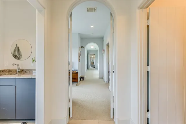 a view of a bathroom with a sink and mirror