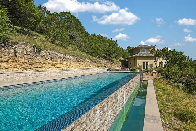 a view of a yard and front view of a house