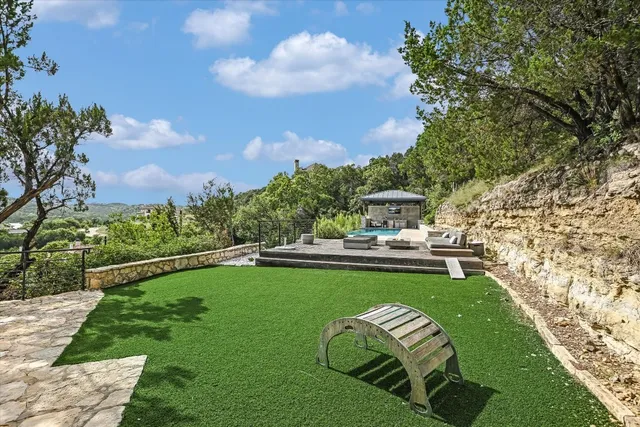 a view of a swimming pool with lounge chair