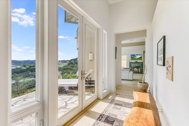 a bathroom with a glass door shower and a yard