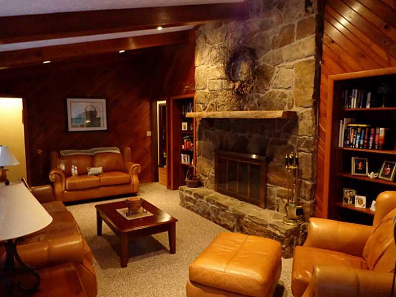 184 Archery Road Berlin, PA 15530 - Photo 8 of 25 Living Room. Stone fireplace in living room