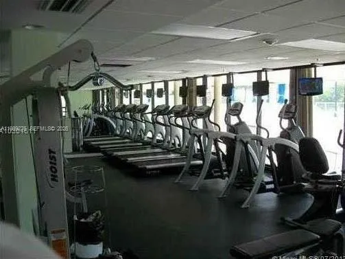 a view of hall way with furniture