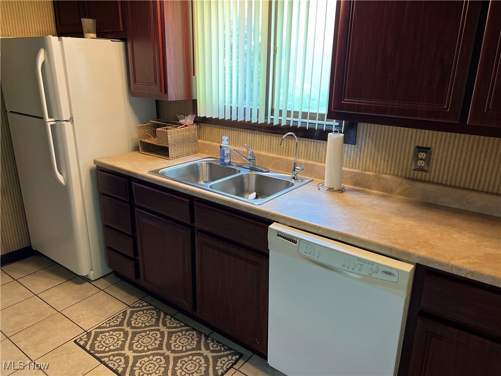 86301 North Bay Road Scio, OH 43988 - Photo 15 of 50 Kitchen featuring sink, white appliances, and light tile patterned flooring