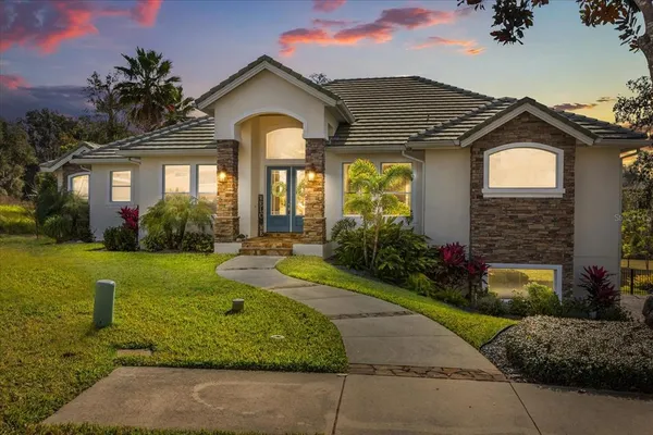 a front view of a house with garden