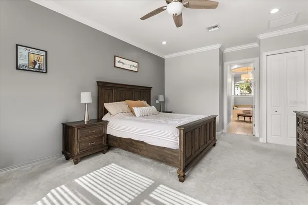 a bed room with a bed and a chandelier