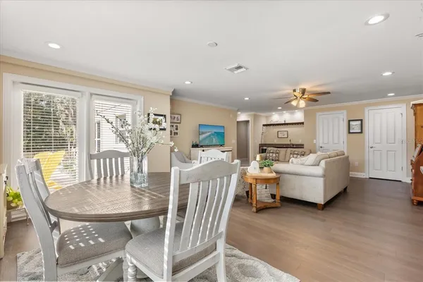 a living room with fireplace furniture and a table