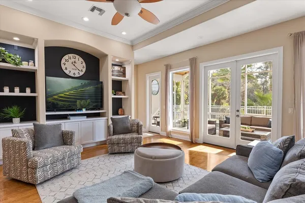 a living room with furniture and a large window