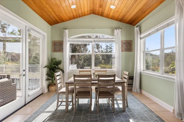 a dining room with furniture and window