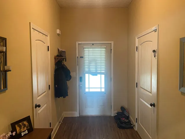 a room that has a bed and a dresser