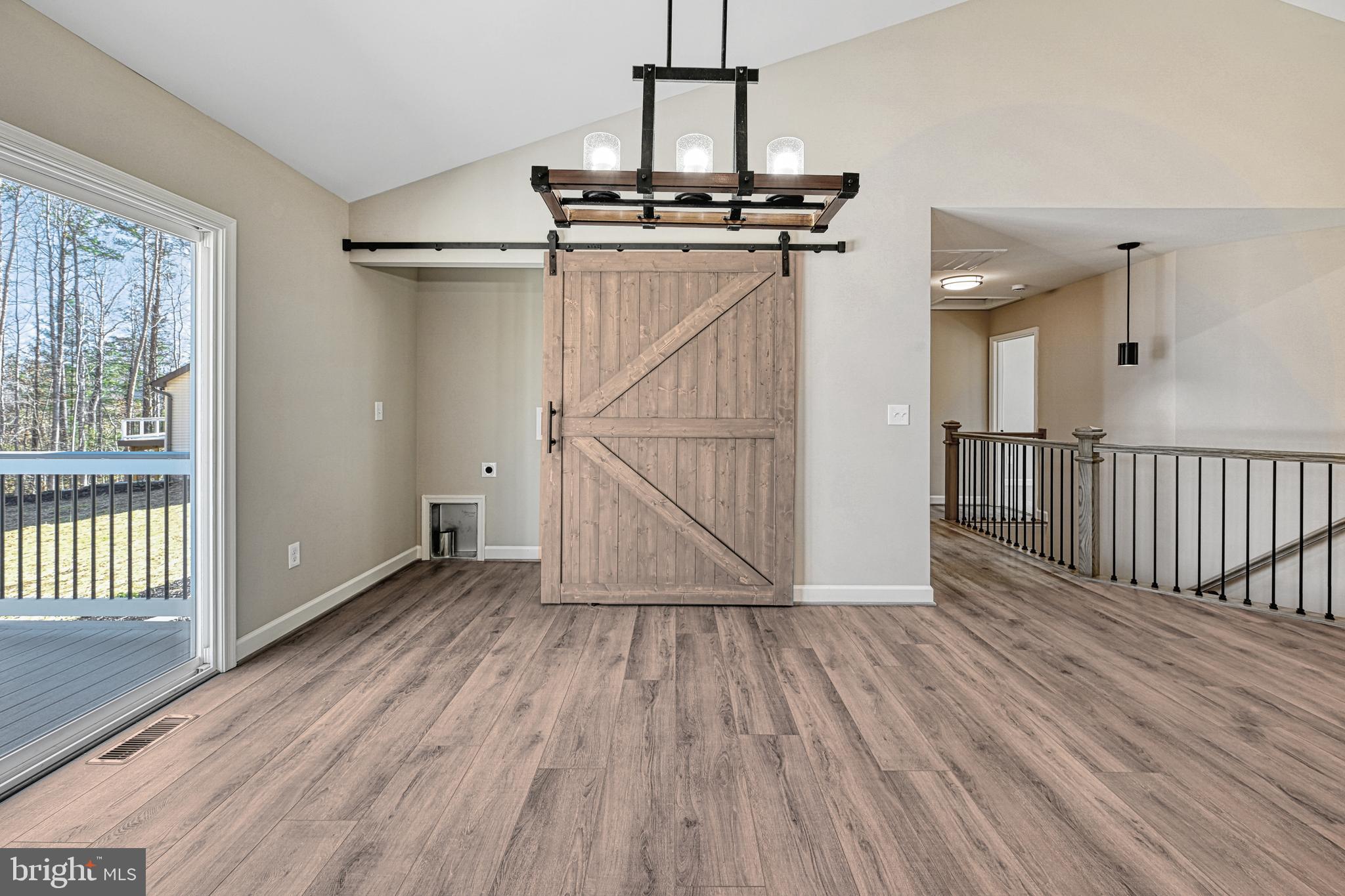 48 Pine Drive Louisa, VA 23093 - Photo 17 of 76 a view of a room with wooden floor staircase and windows