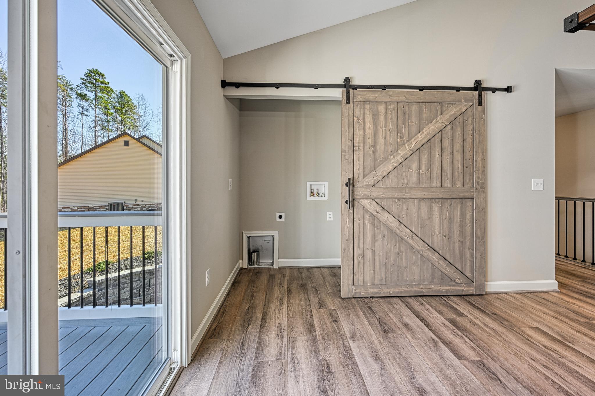 48 Pine Drive Louisa, VA 23093 - Photo 18 of 76 a view of hallway with wooden floor and staircase