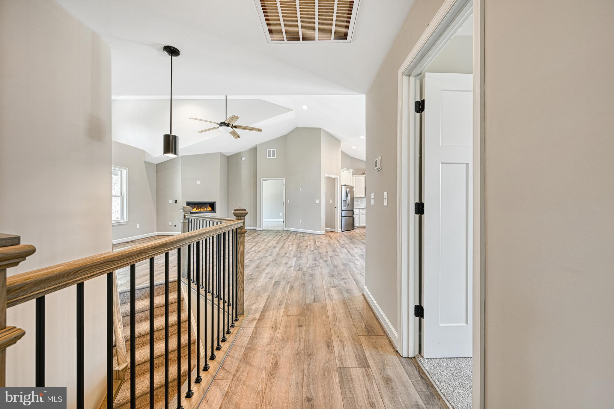48 Pine Drive Louisa, VA 23093 - Photo 31 of 76 a view of a hallway with wooden floor and staircase