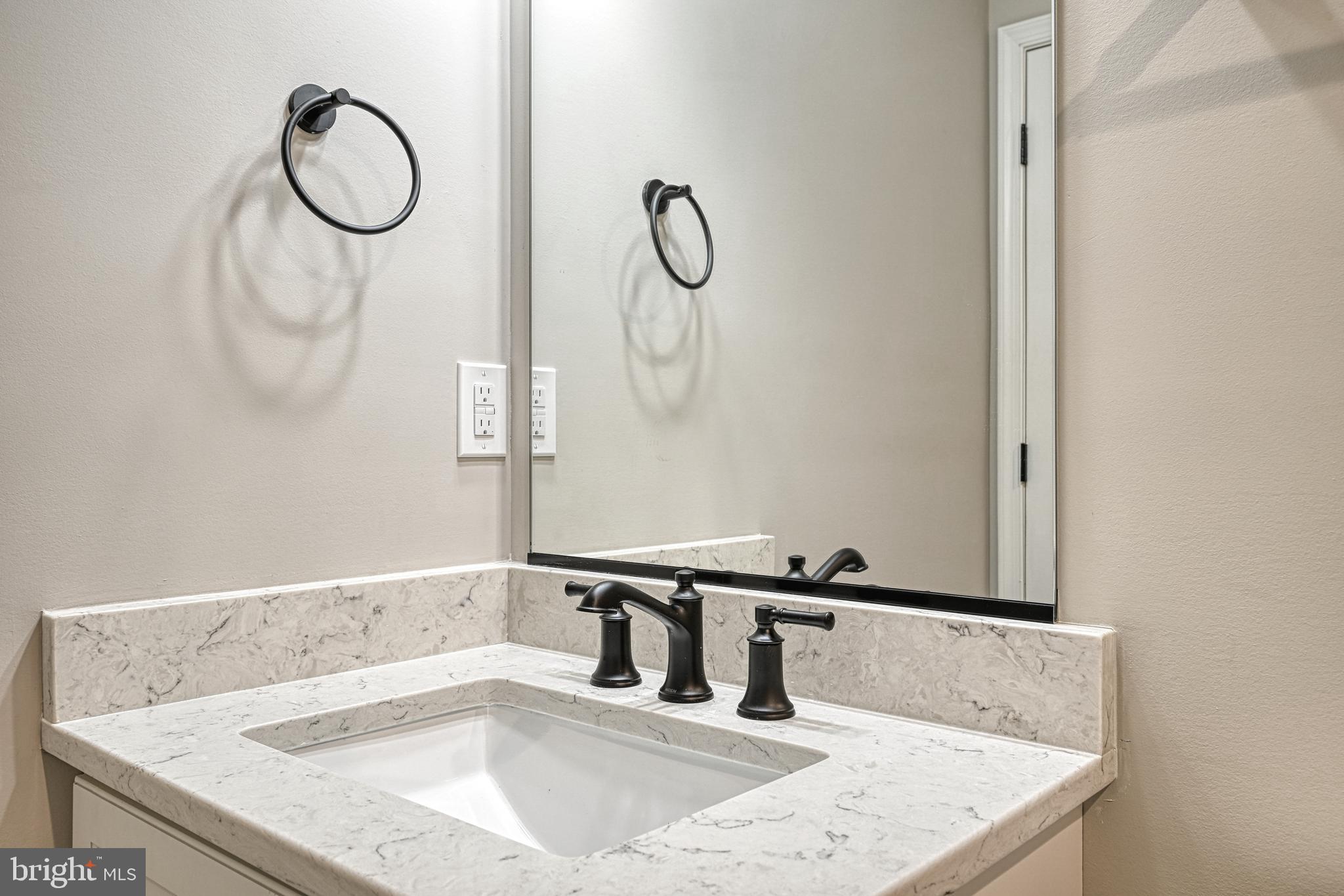 48 Pine Drive Louisa, VA 23093 - Photo 36 of 76 a bathroom with a sink and a mirror